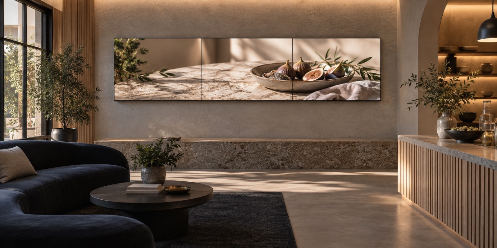Three-panel Kangway video wall installed in a refined commercial showroom lounge